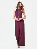 Tuta bordeaux con maxi fiocco al collo