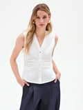 Camicia smanicata bianca con arriccio in vita