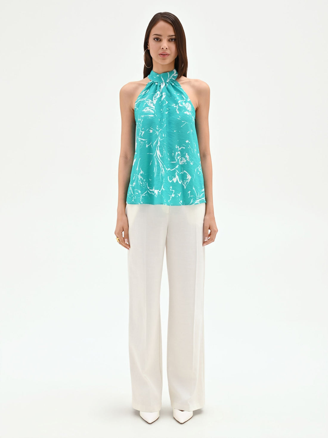 Top turchese con collo arricciato e fantasia