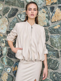 Bomber in similpelle tortora beige con maniche a palloncino