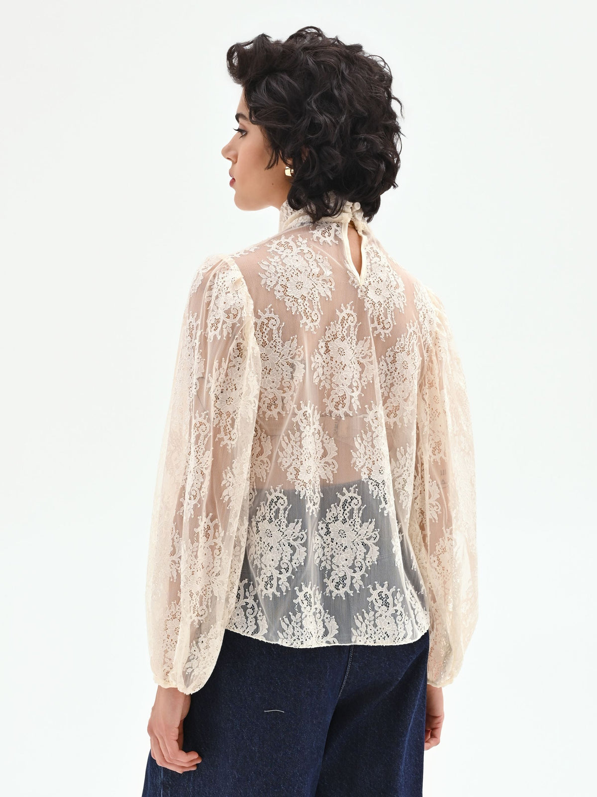Blusa in pizzo panna bianco con collo alto