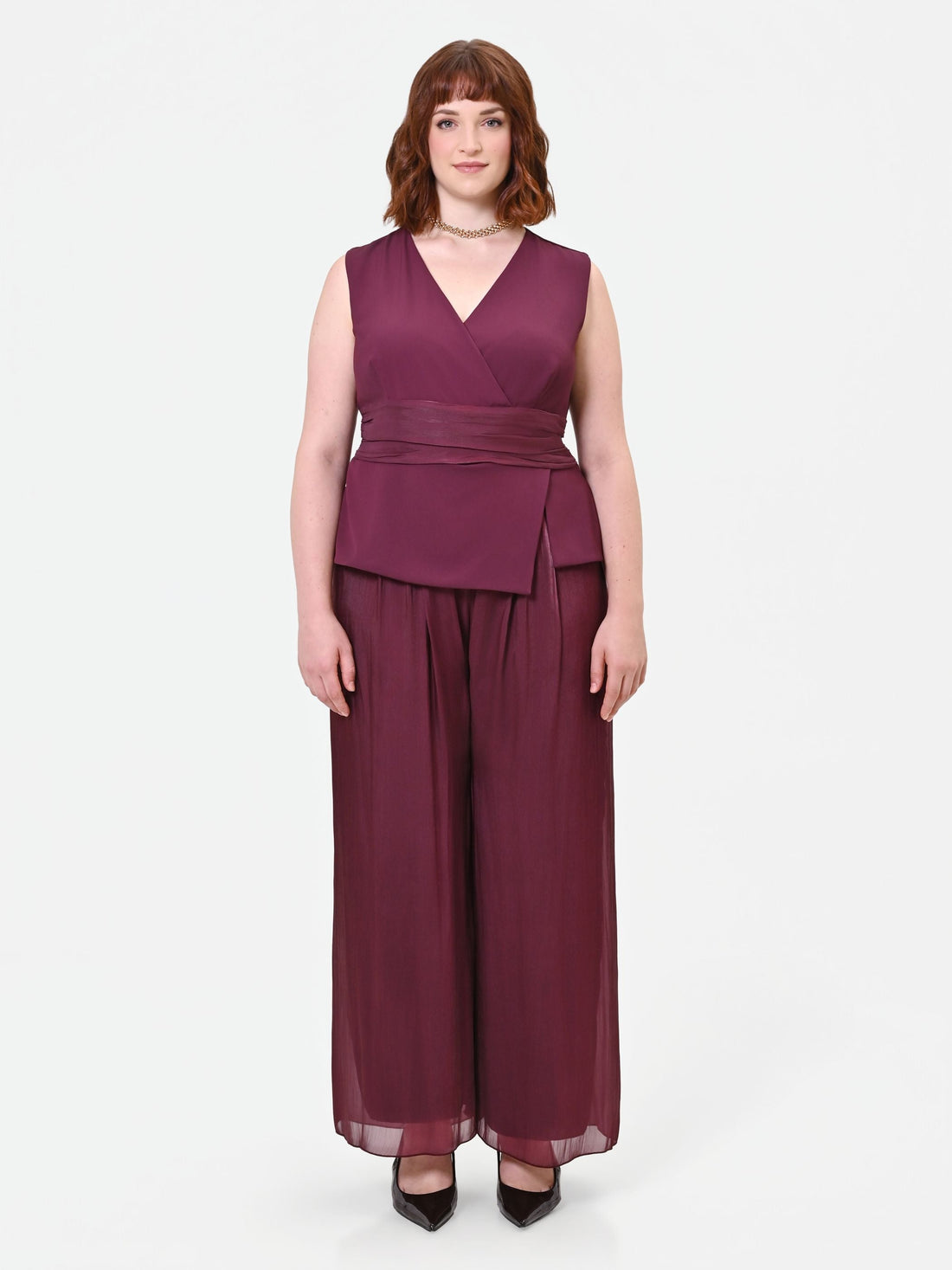 Tuta Curvy bimateriale drappeggiata bordeaux rosso