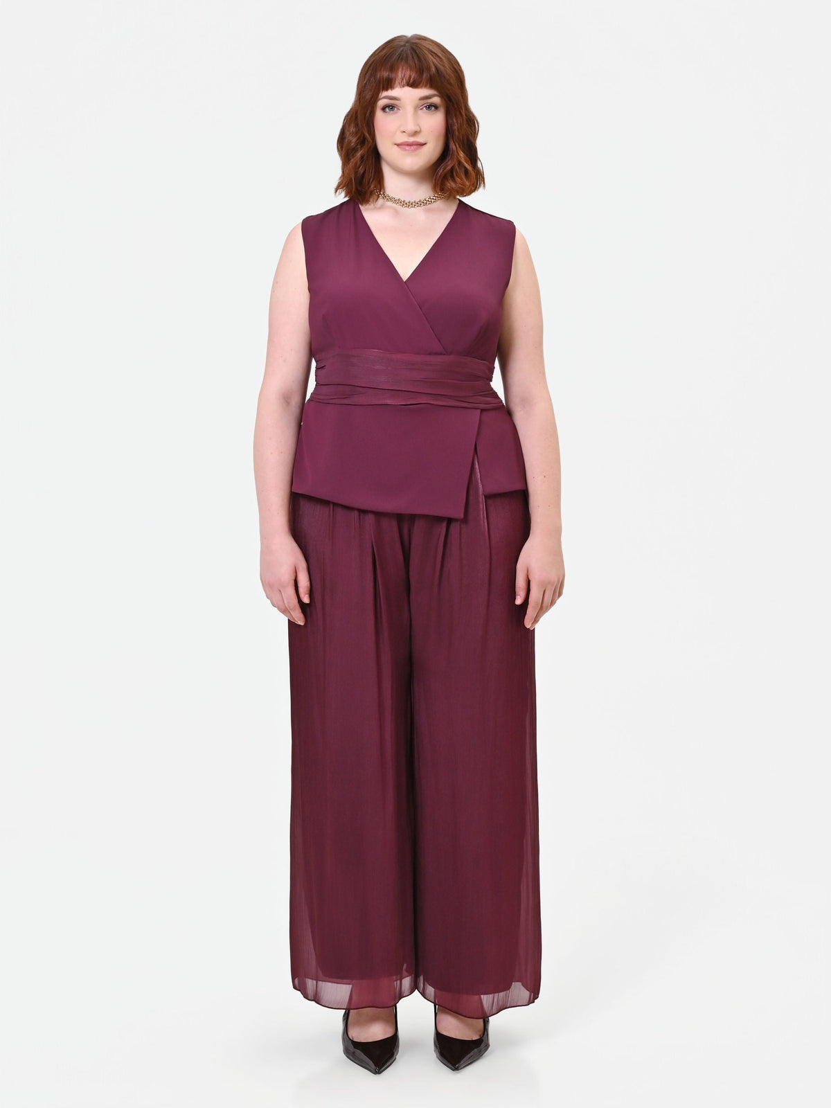 Tuta Curvy bimateriale drappeggiata bordeaux rosso