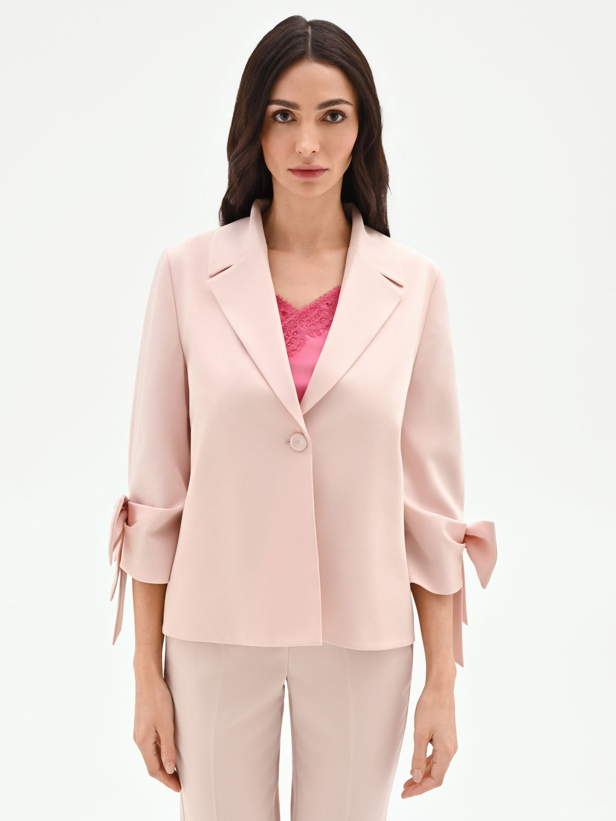 Giacca blazer rosa con fiocco sulla manica