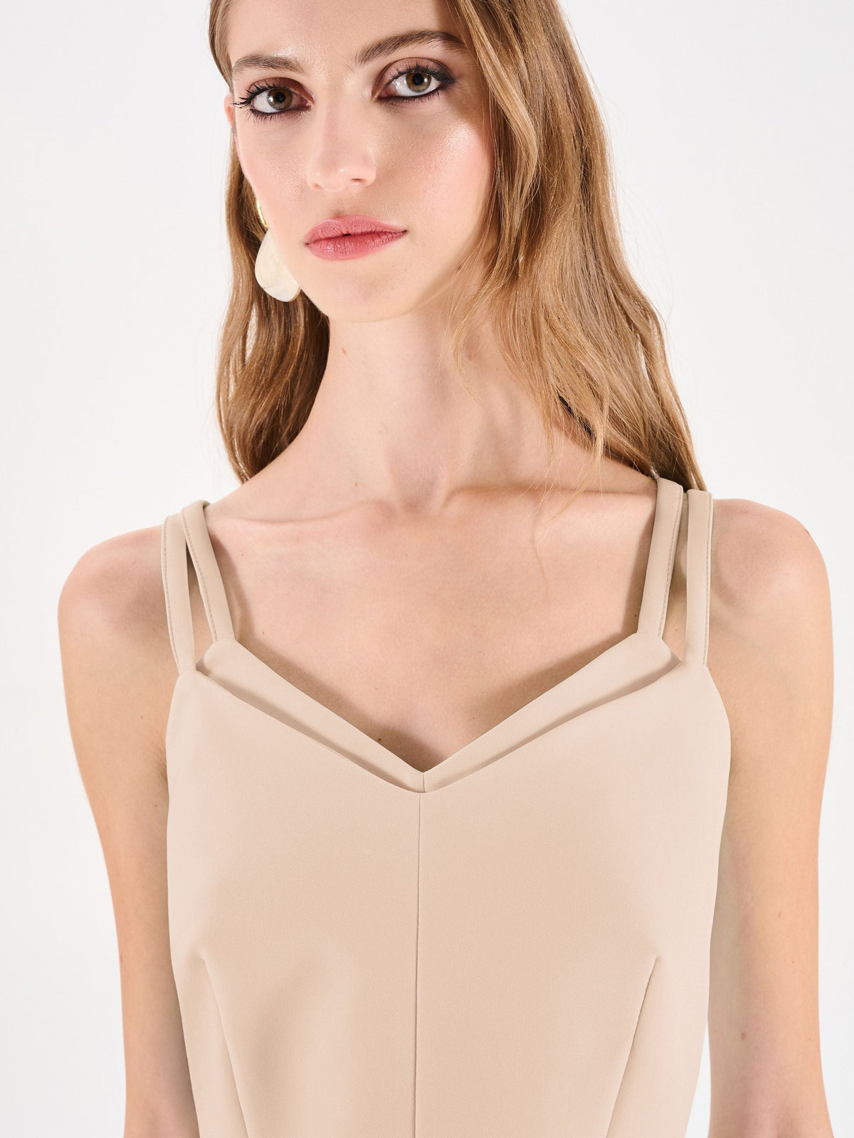 Top crop beige chiaro con doppie spalline