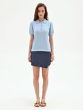 Polo azzurra in maglia a costine