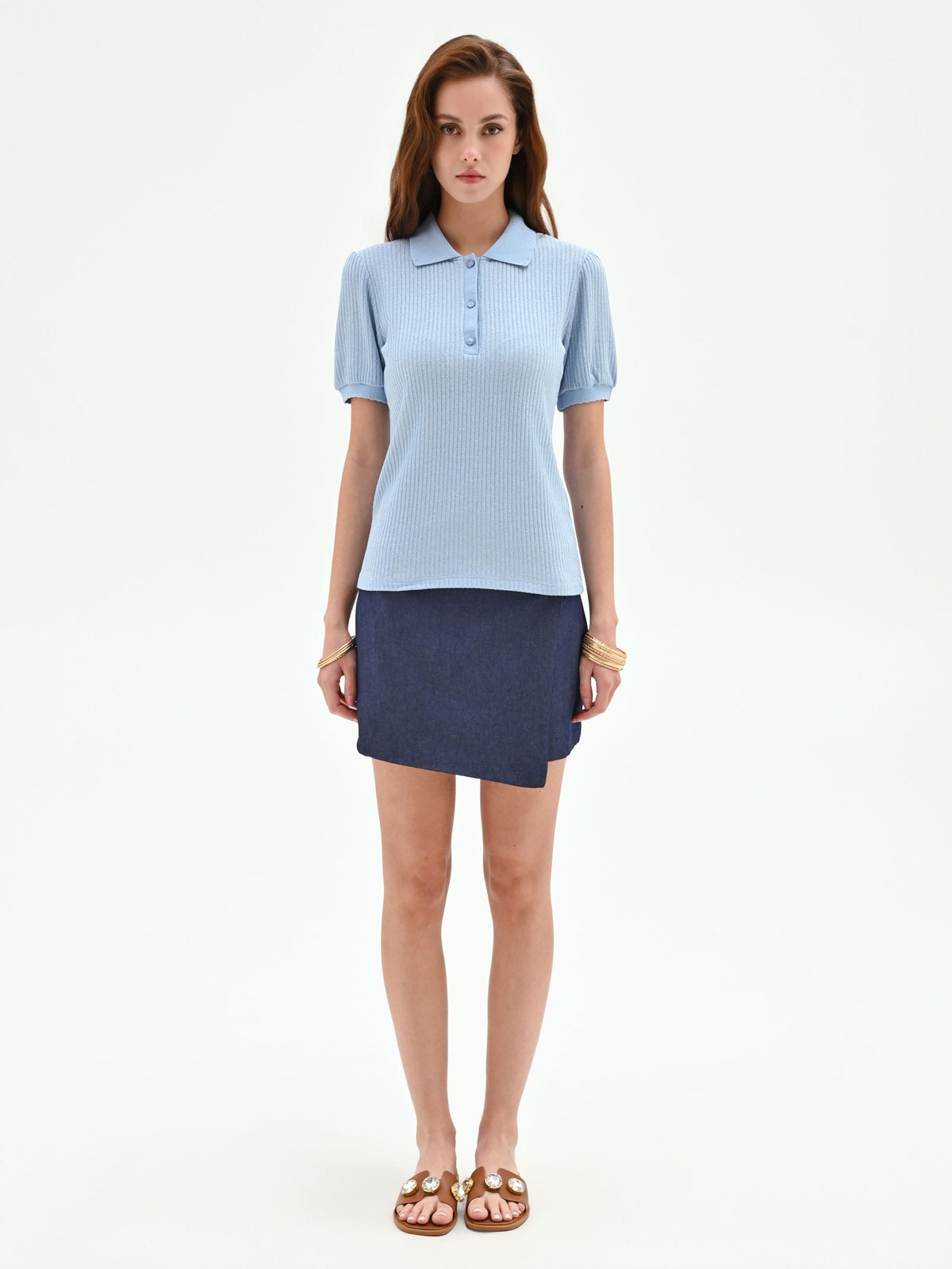 Polo azzurra in maglia a costine