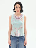 Top verde menta con stampa floreale jacquard