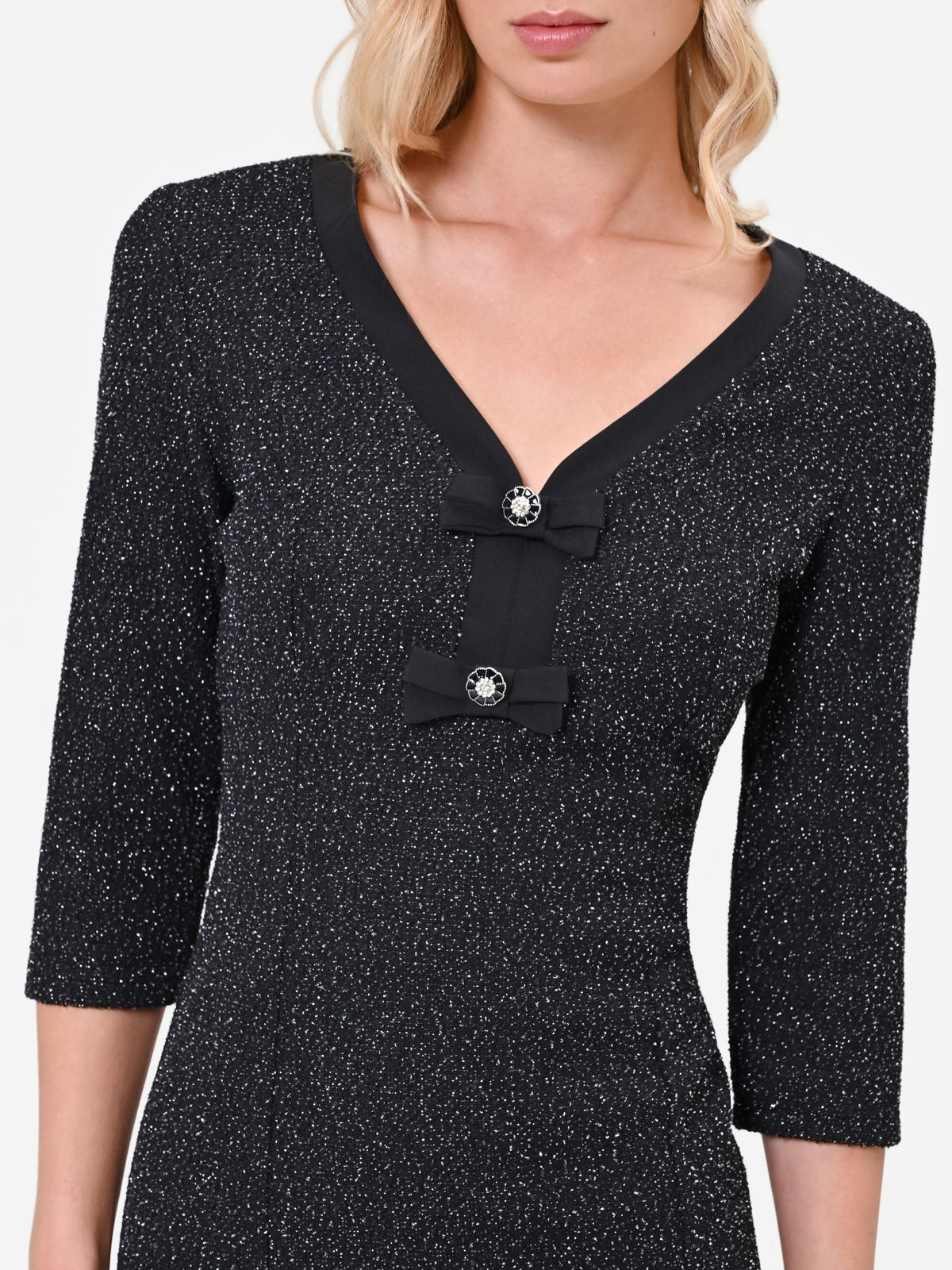 Abito corto nero in tweed con fiocchi