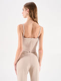 Top beige chiaro con incrocio drappeggiato