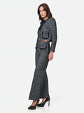 Pantalone nero in bouclé con tasche a toppa