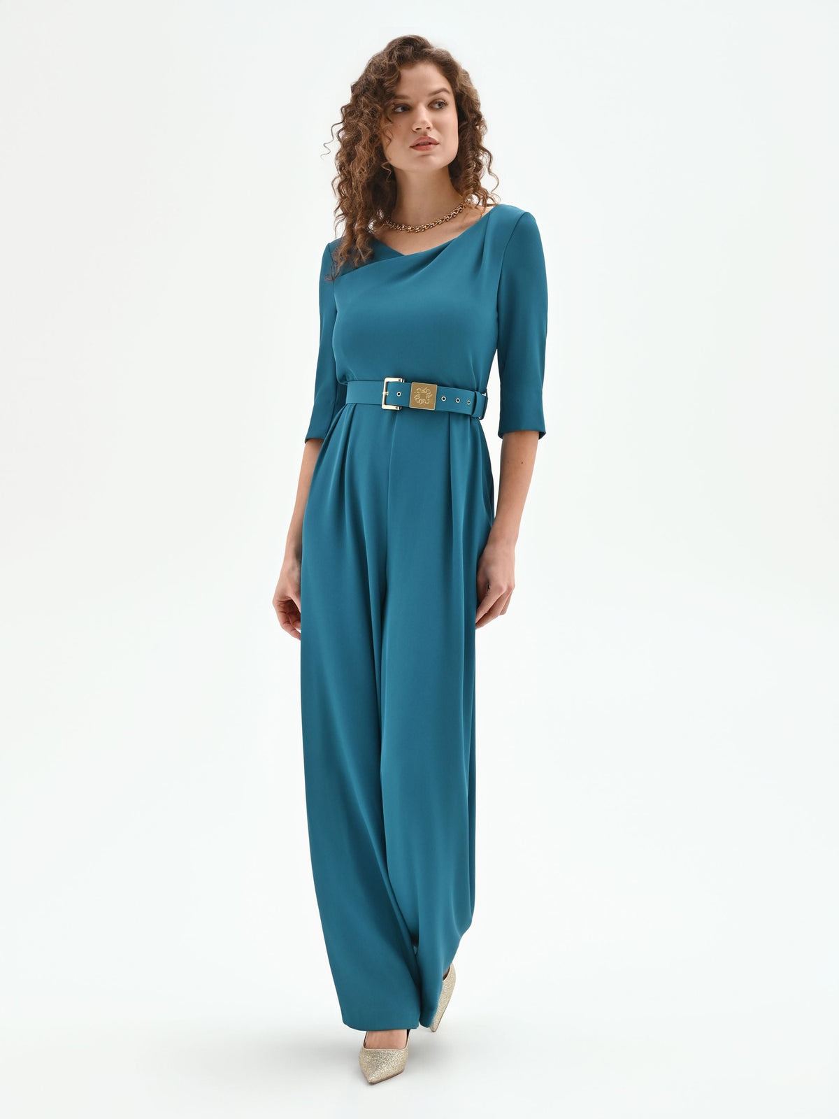 Tuta verde ottanio con scollo drappeggiato