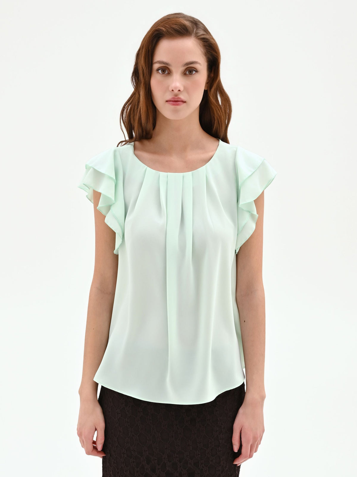 Top verde menta con maniche a volant