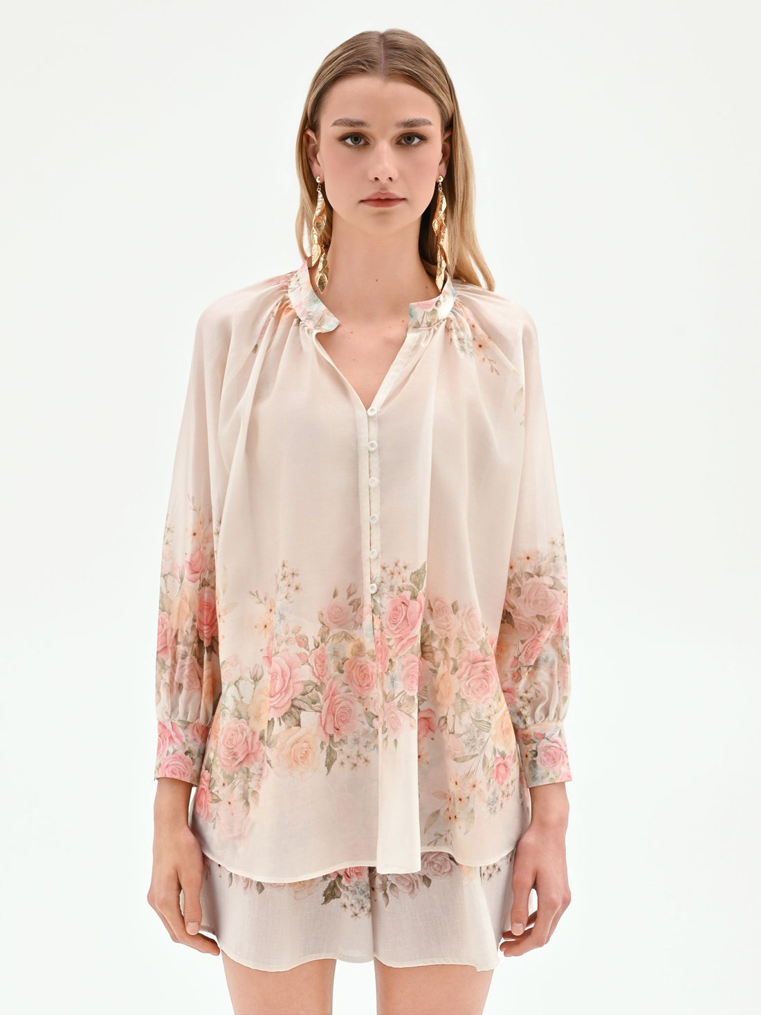 Blusa bianca con stampa floreale a rose