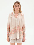 Blusa bianca con stampa floreale a rose