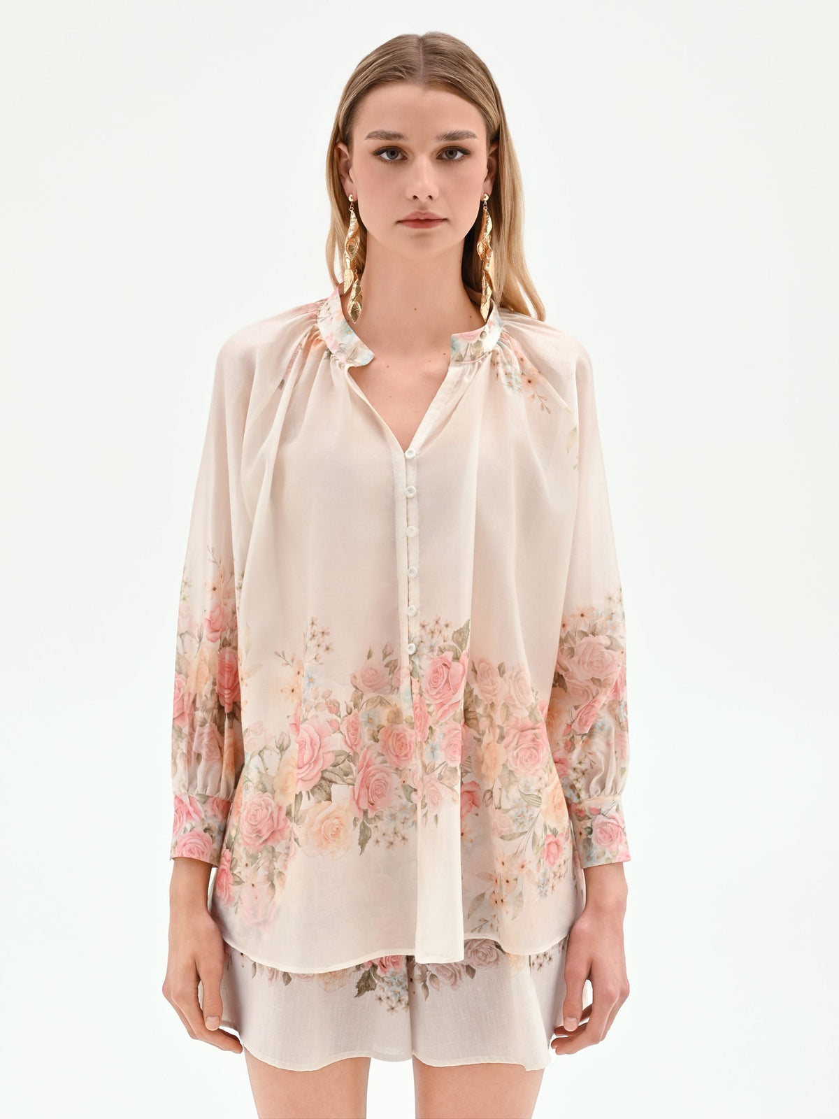 Blusa bianca con stampa floreale a rose