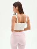 Top crop bianco con doppie spalline