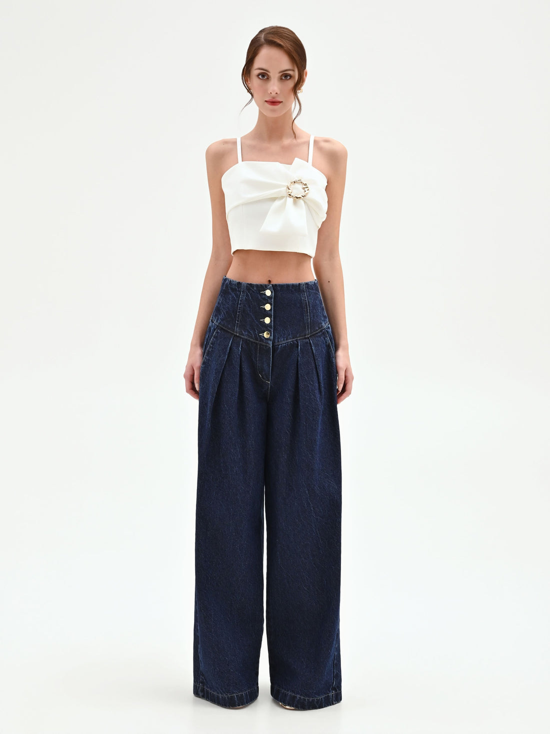 Top crop panna con maxi fiocco