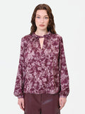 Blusa rosso bordeaux con fantasia e collo a torchon