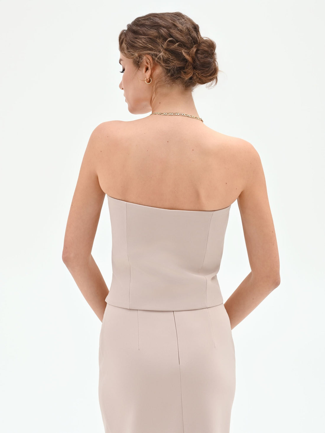 Top Studio beige a cuore con impunture