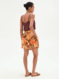 Pantaloncino arancione a fantasia tropicale