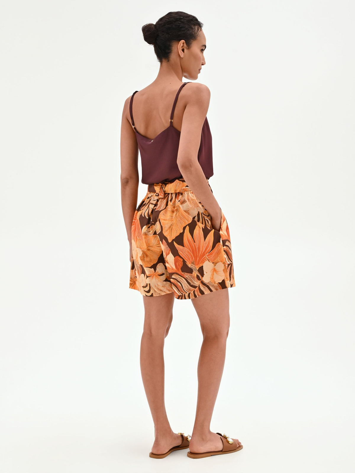 Pantaloncino arancione a fantasia tropicale