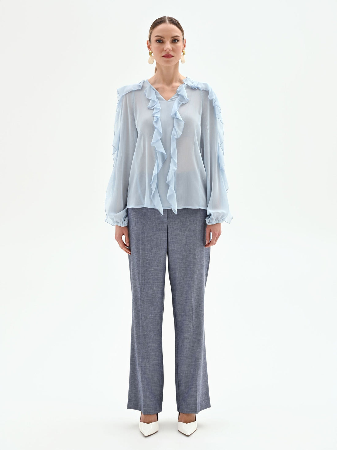 Blusa azzurro cielo con rouches