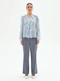 Blusa azzurro cielo con rouches