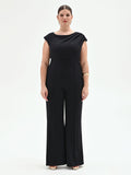 Tuta nera curvy con scollo asimmetrico
