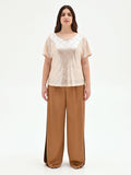 Blusa curvy beige chiaro con paillettes all over