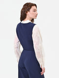 Gilet blu con bottoni gioiello