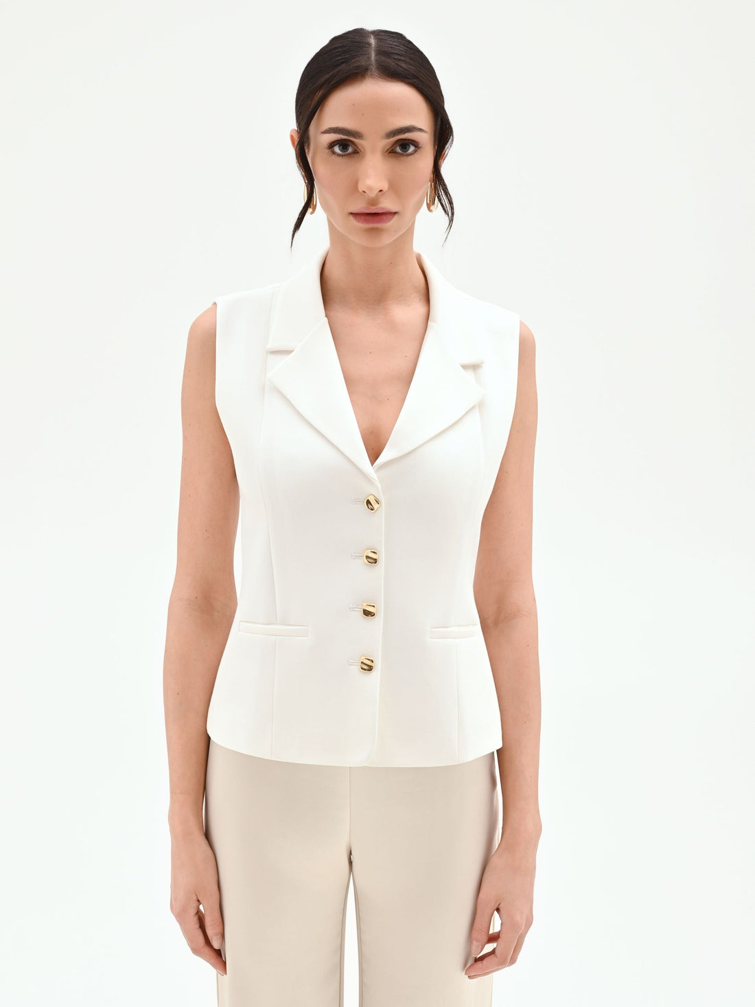 Gilet panna con bottoni design oro