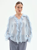Blusa azzurro cielo con rouches