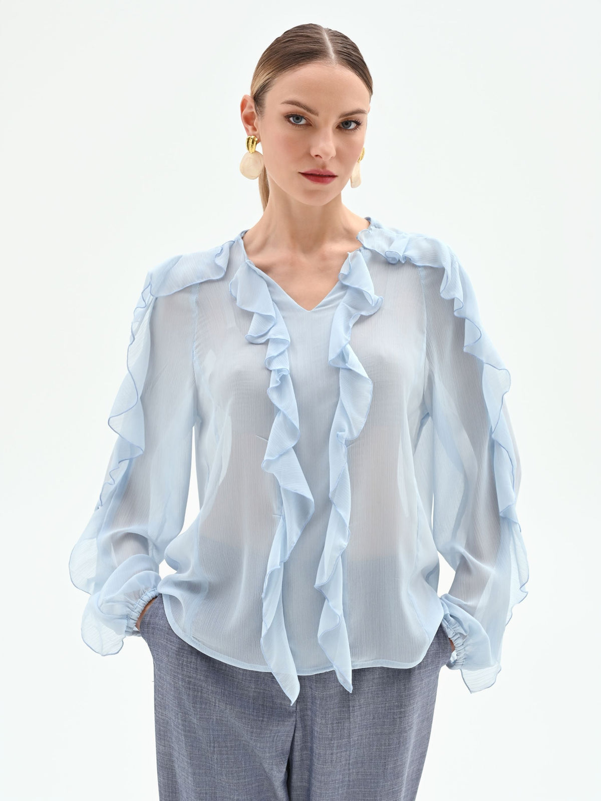 Blusa azzurro cielo con rouches
