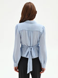 Blusa cielo azzurro con incrocio a portafoglio