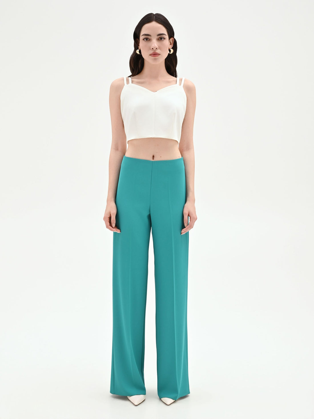 Pantalone palazzo turchese azzurro dalla linea fluida