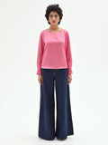 Blusa rosa con maniche a sbuffo