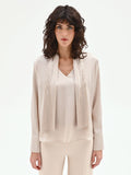 Blusa beige chiaro con foulard plissettato