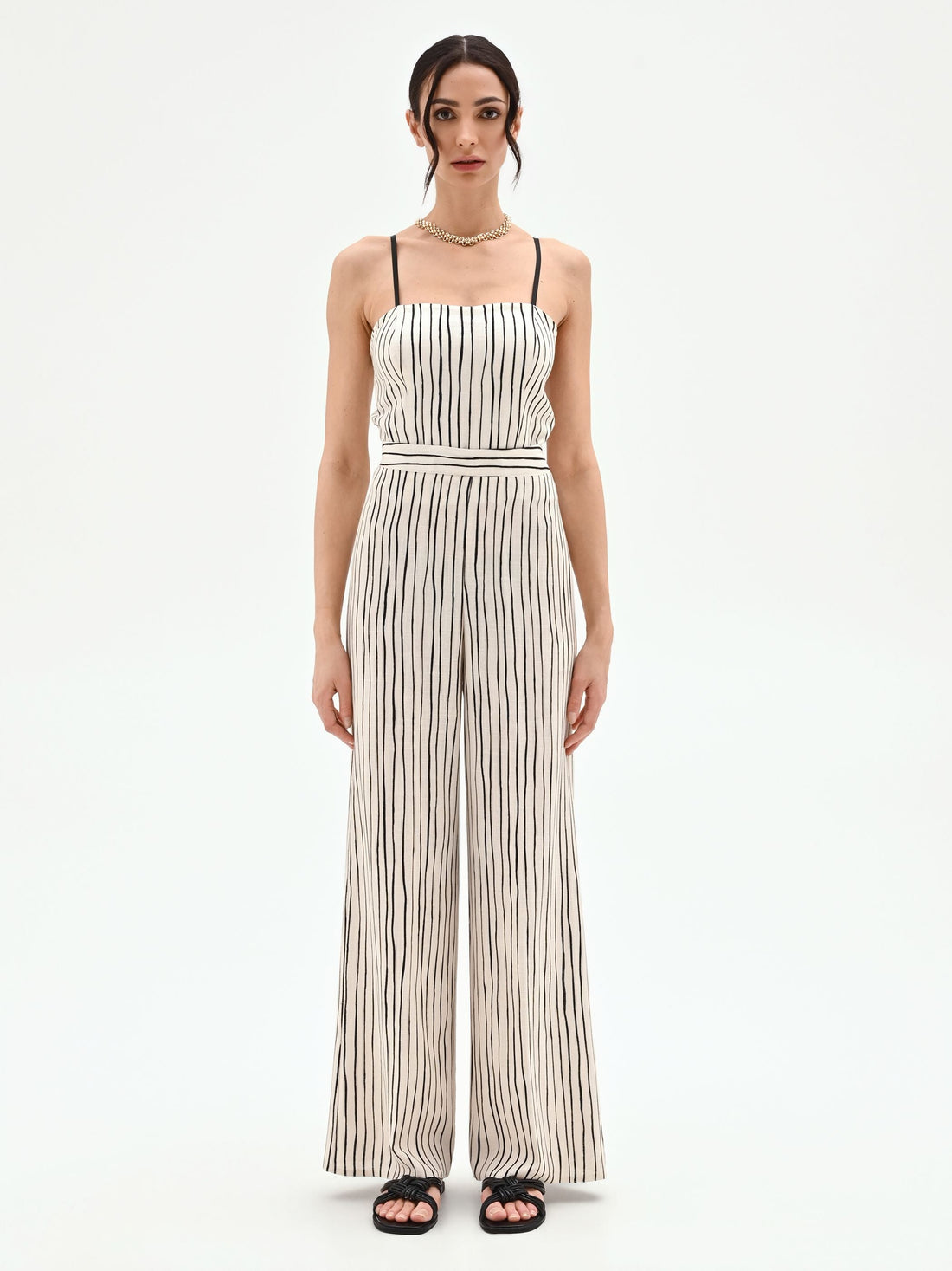 Pantalone in lino panna a palazzo con fantasia a righe