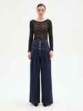 Blusa nera in pizzo floreale
