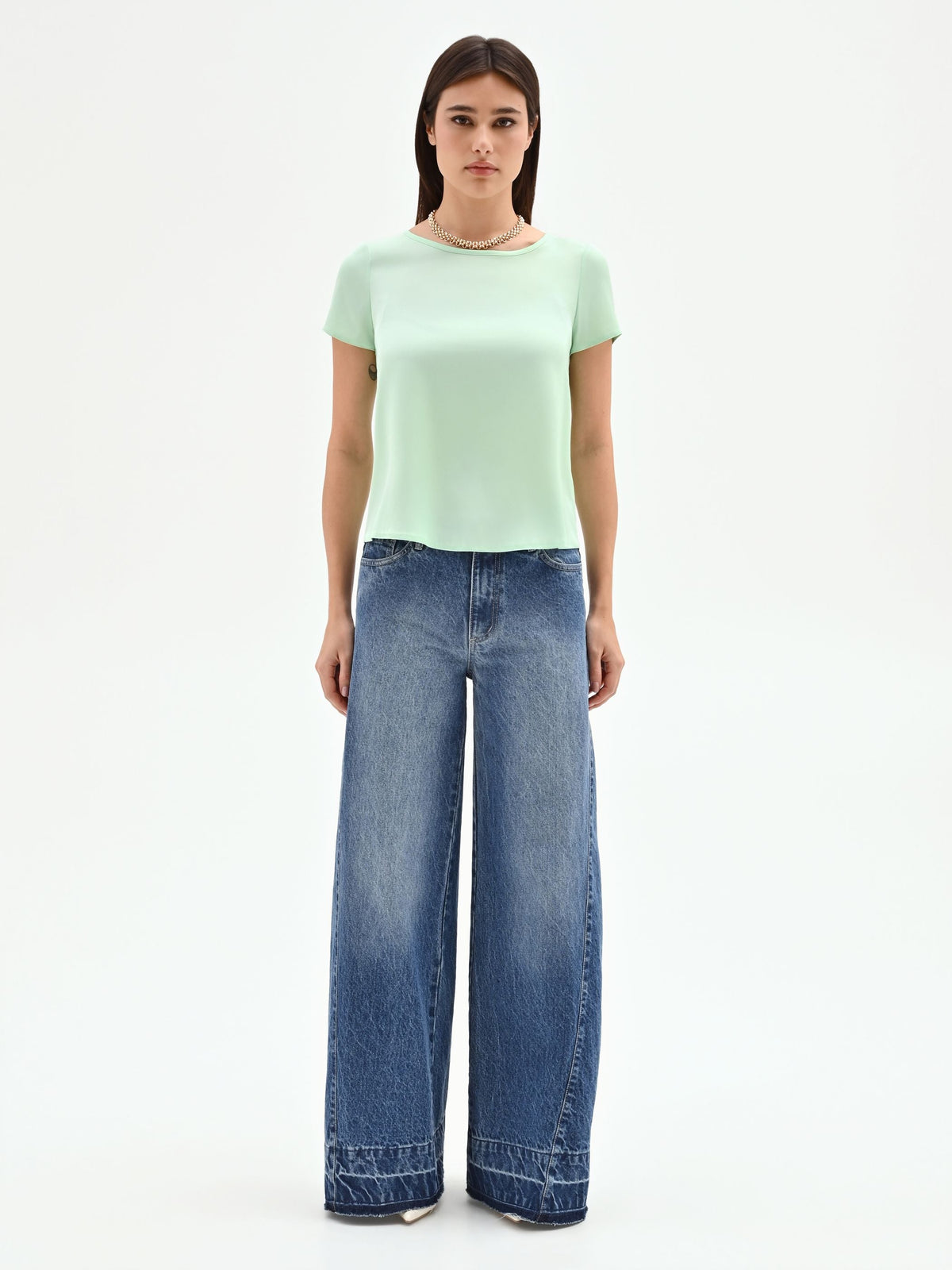 Blusa verde menta in tessuto fluido