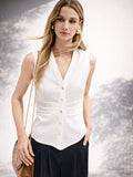 Camicia smanicata bianca con arriccio in vita