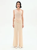 Tuta elegante beige chiaro con corpetto drappeggiato