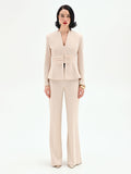 Giacca beige chiaro con drappeggio in vita