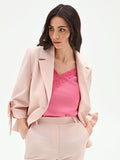 Giacca blazer rosa con fiocco sulla manica