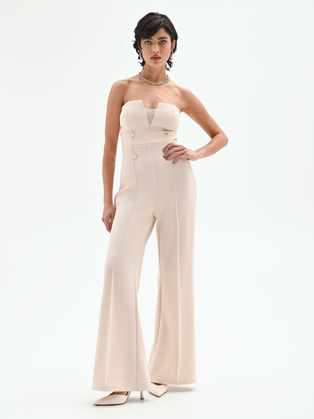 Tuta palazzo beige chiaro con bottoni e bustier
