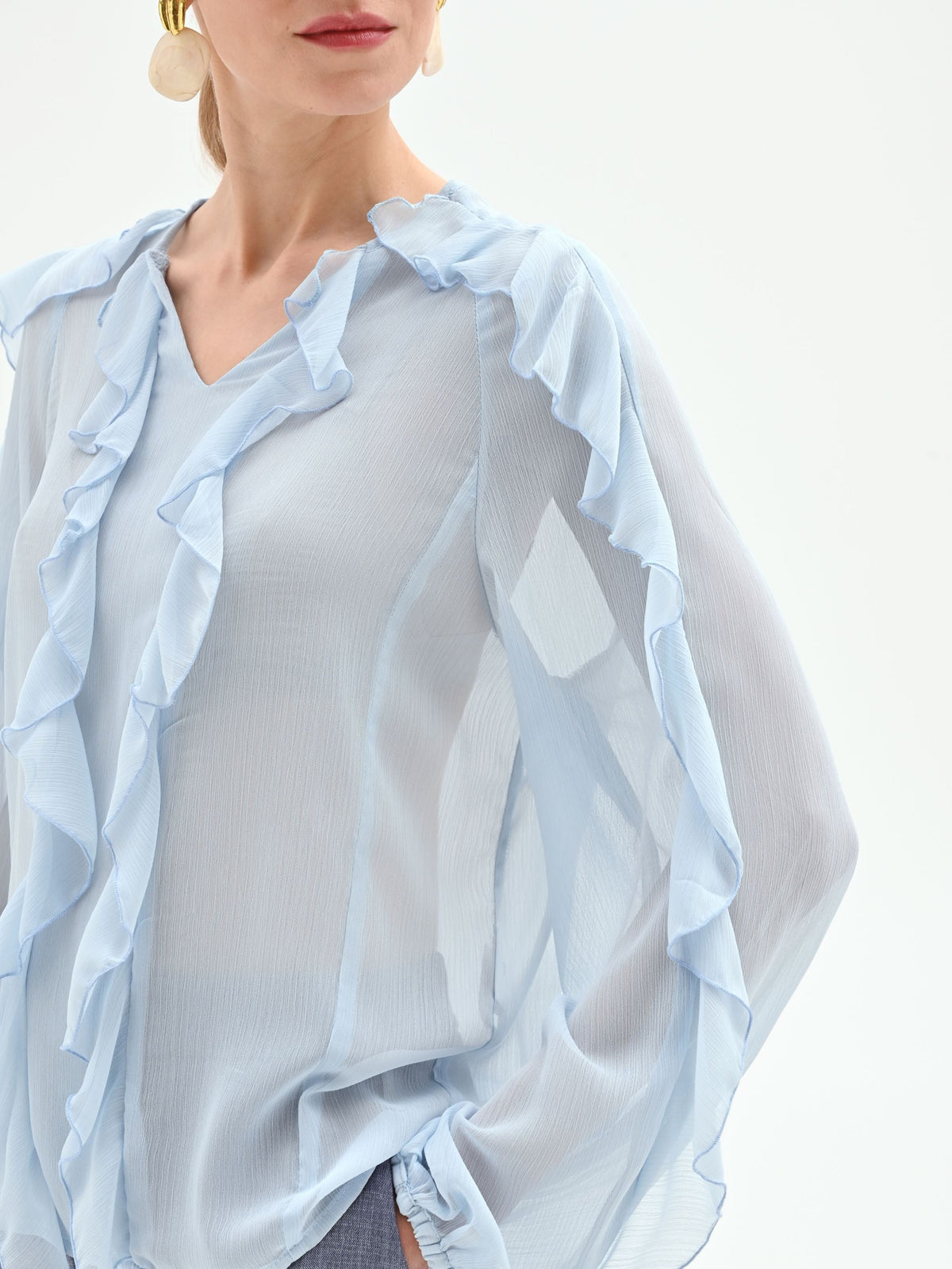 Blusa azzurro cielo con rouches