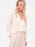 Blusa bianca con incrocio in raso