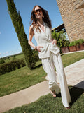 Pantalone bianco a palazzo con pinces