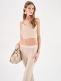 Top crop beige chiaro con doppie spalline